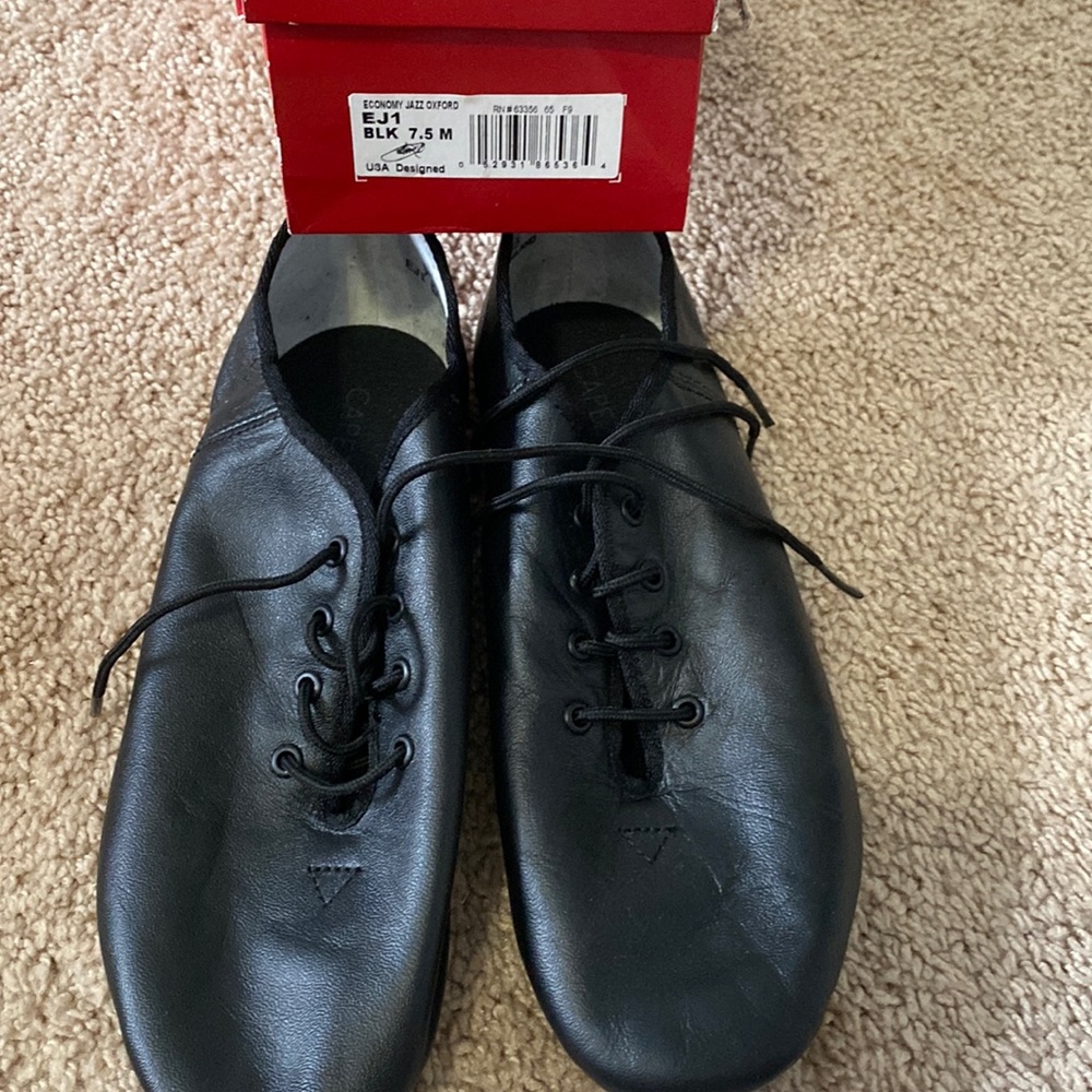 Brand new in box. Capezio black jazz lace up. Size 7.5
